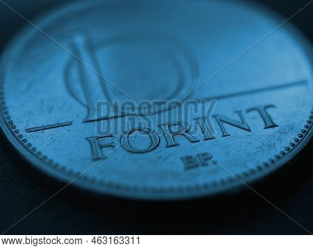 Hungarian Coin Of 10 Forints Lies On A Dark Surface Closeup. Money Of Hungary. News About Economy Or