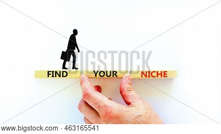 Find Your Niche Symbol. Concept Words Find Your Niche On Wooden Blocks. Businessman Hand. Beautiful 
