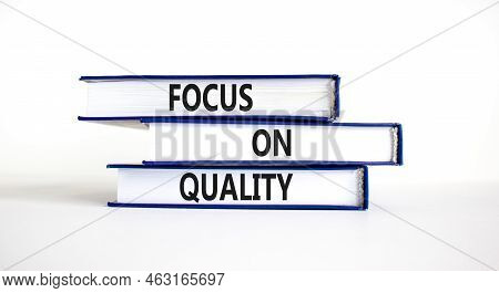 Focus On Quality Symbol. Concept Words Focus On Quality On Books On Beautiful White Table White Back