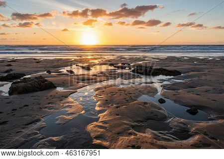 Beautiful Summer Sunset Landscape Image Of Widemouth Bay In Devon England With Golden Hour Light On 