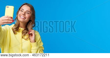 Close-up Portrait Tender Cute Blond Girl In Yellow Hoodie, Holding Mobile Phone, Taking Selfie With 