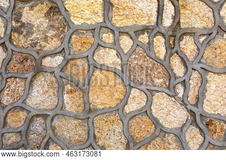 The Texture Of Natural Stone With Cement Seams Of Arbitrary Shape. A Wall Of Stones Of Arbitrary Sha