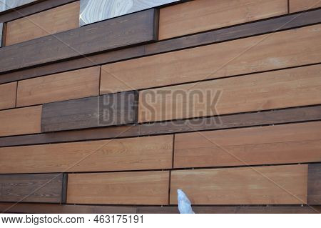 Building Facade Wall. Finishing With Decorative Wooden And Mirror Panels. Beautiful Brown Wooden Bac
