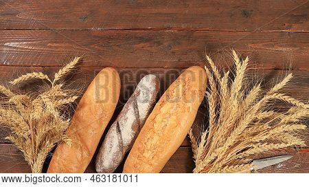 Freshly Baked Homemade Bread, French Sourdough Baguette With Crispy Crust And Ears Of Rye And Wheat 