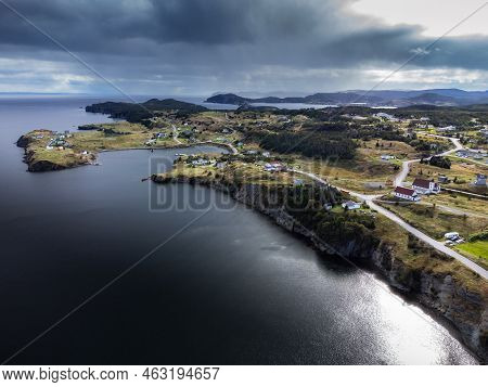 Aerial Newfoundland East Coast Community With Homes On High Cliffs Near Port Rexton And The Distant 