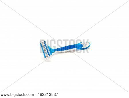 Single Brand New Blue And White Plastic Disposable Razor With Ergonomic Handle Isolated On White Bac