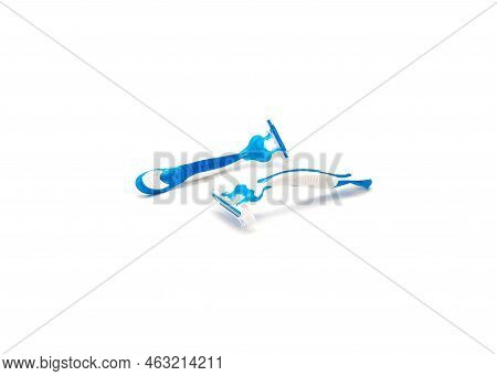 Two Brand New Blue And White Plastic Disposable Razors With Ergonomic Handle Isolated On White Backg