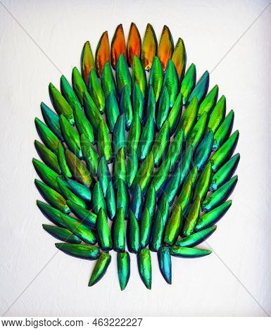Composition Of Jewel Beetle Wings Sternocera Ruficornis In Form Of A Burdock Flower. Collage For Des