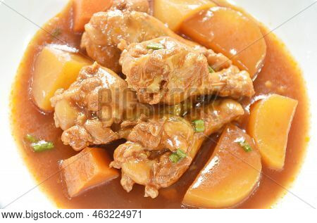 Boiled Chicken Leg With Potato In Swet Red Gravy Sauce Stew On Plate