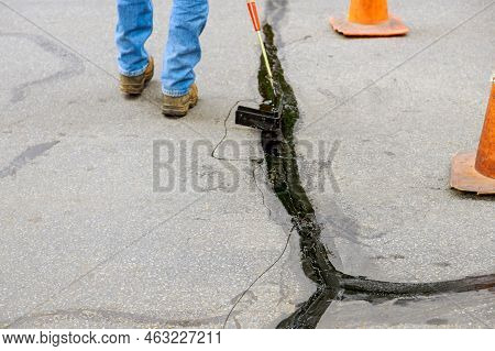 An Asphaltic Joint Crack Needs To Be Sealed In Restoration Work Asphalt Road Surface