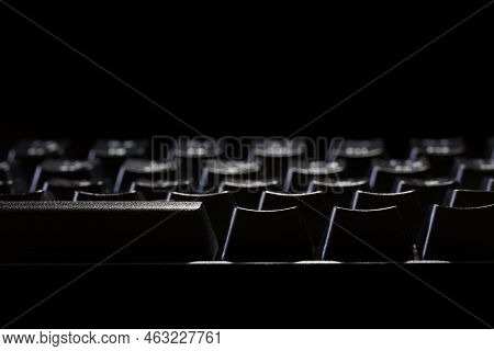 Black Gaming Mechanical Computer Keyboard On A Black Background. Fragment. Copy Space. Macro. Select