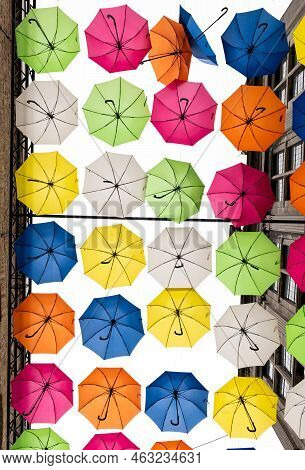 Veurne, West Flanders Region - Belgium - 07 18 2021 Artistic Installation Of Multicolored Umbrella
