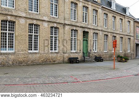 Veurne, West Flanders Region - Belgium - 07 18 2021 Facade Of A Traditional Building In Nature Stone