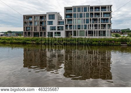 Ename, East Flanders Region -  Belgium - 07 11 2021 Residential Apartment Buildings Reflecting In Th