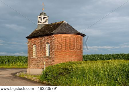 Denderwindeke, Ninove, East Flemish Region - Belgium - 07 14 2021 Brick Stone Chapel In The Agricult