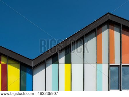 Dilbeek, Flemish Brabant Region, Belgium - 7 2 2021 Abstract Colors And Lines From The Facade Of A C