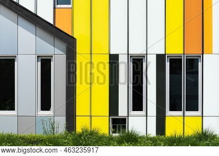 Dilbeek, Flemish Brabant Region, Belgium - 7 2 2021 Abstract Colors And Lines From The Facade Of A C