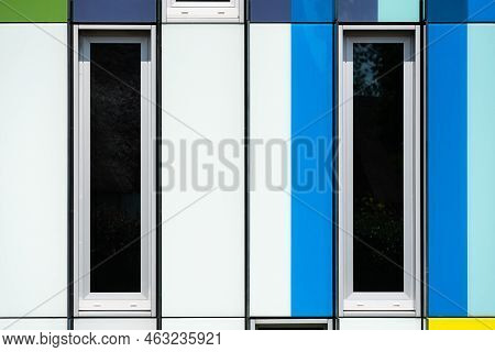 Dilbeek, Flemish Brabant Region, Belgium - 7 2 2021 Abstract Colors And Lines From The Facade Of A C