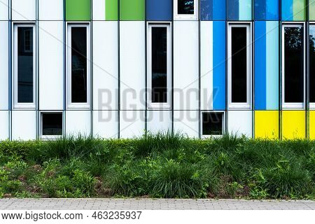 Dilbeek, Flemish Brabant Region, Belgium - 7 2 2021 Abstract Colors And Lines From The Facade Of A C