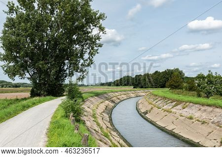 The Meandering River Senne With The Green Banks And A Bicycle Trail, Zemst, Belgium