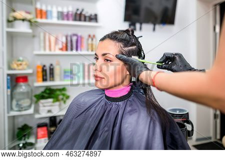 The Hairdresser Applies Professional Liquid Keratin To The Client's Hair. A Girl Does Keratin Hair S