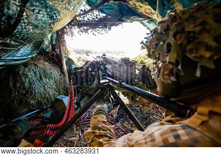 Close-up Soldiers Firing A 50 Cal Machine Gun With Spent Brass Around Ii