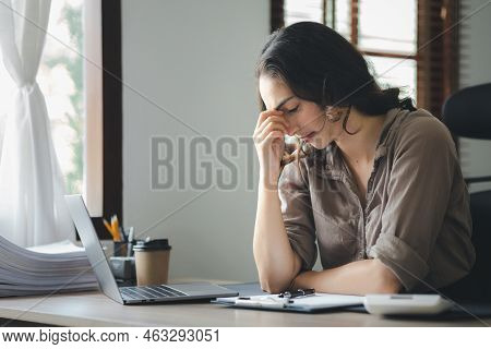 Beautiful Asian Woman Working In An Office, She Is A Businesswoman Who Owns A Company, She Has A Hea