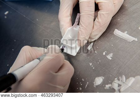 Scientist Preparing Paraffin Blocks Containing Biopsy Tissue For Sectioning. Pathology Laboratory. C