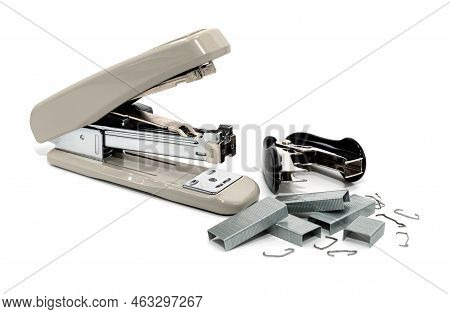 Stapler And Anti-stapler With Staples On A White Background. Office Supplies Isolate