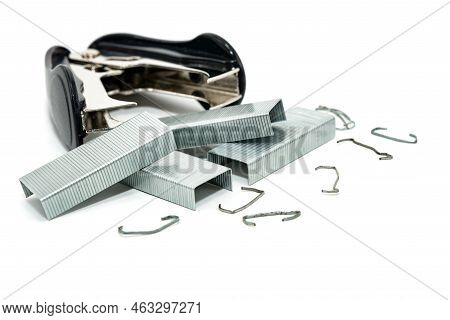 Stapler And Anti-stapler With Staples On A White Background. Office Supplies Isolate