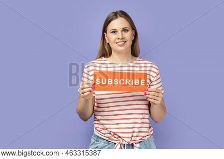 Portrait Of Winsome Adorable Pretty Woman Wearing Striped T-shirt Holding Card With Subscribe, Femal