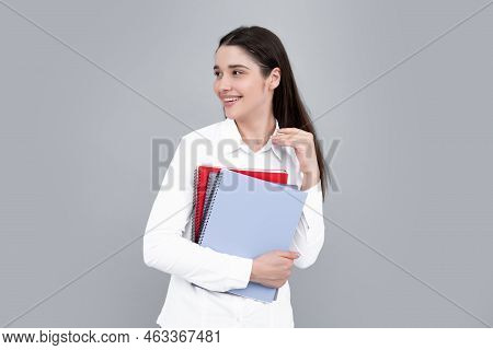 Portrait Of Student Woman. College Or High School Ducation. Young Woman With Notebooks Smiling At Ca