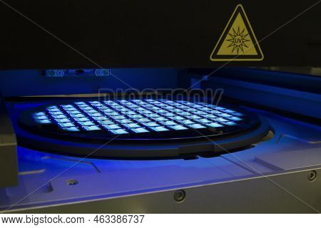 Silicon Wafer With Chips In Uv Lighting. Neon. Ultraviolet Lithography.