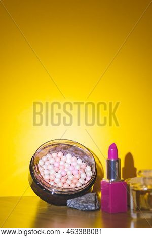 Makeup Products And Decorative Cosmetics On Zellow Background Flat Lay. Fashion And Beauty Blogger C