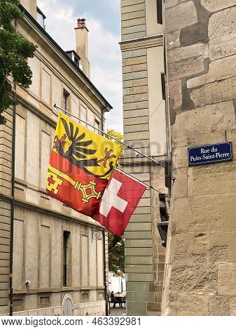 Geneva, Switzerland - September 15 2021: Both The National Flag Of Switzerland As The Flag Of The Ci