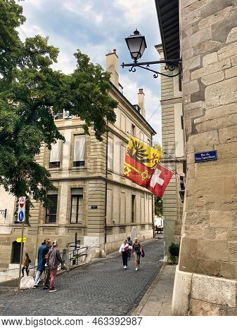 Geneva, Switzerland - September 15 2021: Both The National Flag Of Switzerland As The Flag Of The Ci
