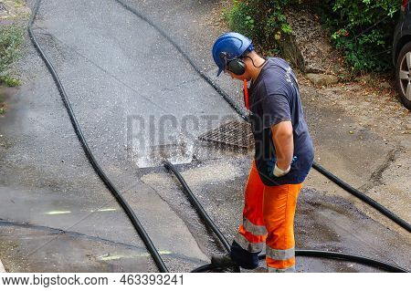 Menthon Saint Bernard, France - September 09 2021: A Professional Worker Is Busy With A Pump Car And