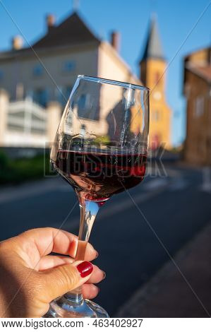 Tasting Of Red Wine By Old Wine Maker In Pierres Dorées Region With Yellow Stone Houses On South Of