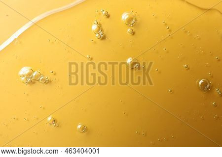 Sample Of Hydrophilic Oil On Orange Background, Top View