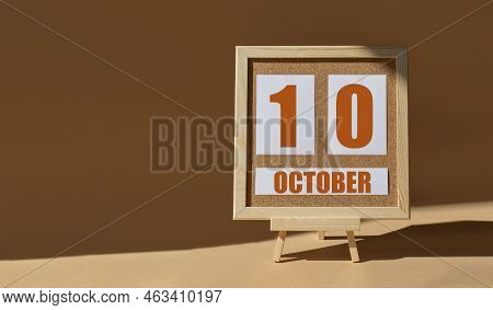 October 10th. Day 10 Of Month, Calendar Date. Cork Board, Easel In Sunlight On Desktop. Close-up, Br