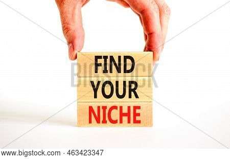Find Your Niche Symbol. Concept Words Find Your Niche On Wooden Blocks. Businessman Hand. Beautiful 
