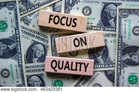Focus On Quality Symbol. Concept Words Focus On Quality On Blocks On Beautiful Background From Dolla