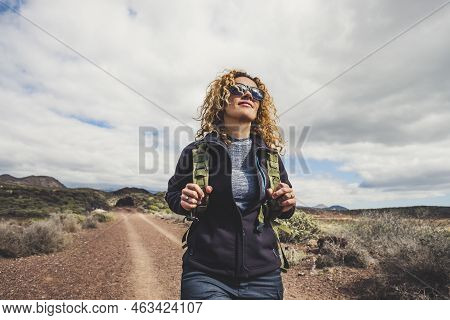 Young Beautiful Woman With Backpack And Trekking Clothes Hiking In The Mountains. Concept Healthy An