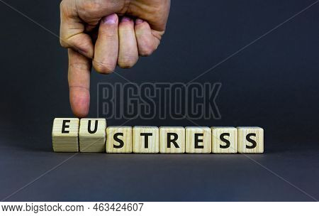 Eustress Or Stress Symbol. Psychologist Turns Cubes And Changes The Concept Word Eustress To Stress.
