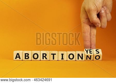 Abortion Yes Or No Symbol. Concept Words Abortion Yes Or Abortion No On Wooden Cubes. Doctor Hand. B