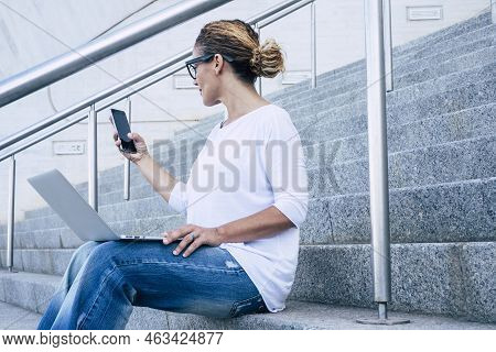 Business Woman Beautiful Female Working With Phone Device And Laptop Computer Aoutdoor Witting On A 