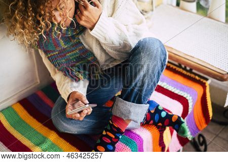 Beautiful Caucasian Woman Smile While Message At Home Outdoor On The Terrace With A Smart Phone - Co