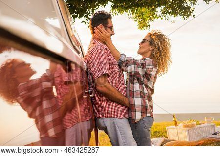 Couple In Love Middle Age Caucasian Beautiful People Hug During A Picnic And Vacation Travel Or Outd
