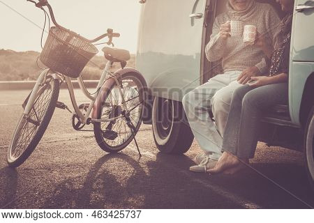 Not Recognizable Couple Of Caucasian Couple Having Fun And Drinking Coffee Together Sitting Outside 