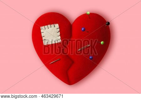 Broken Heart With Pins, Sewing Needle And Patch On Pink Background - Concept Of Healing A Broken Hea